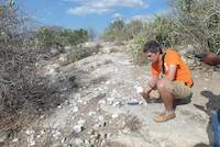 Mr. Jean Louis inspecting rocks